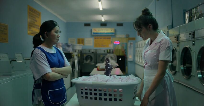 small man in laundry basket in the laundry mat for Reckon ad