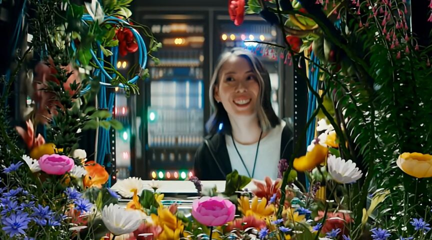 women looking at flowers inside of a computer box for Splunk Commercial