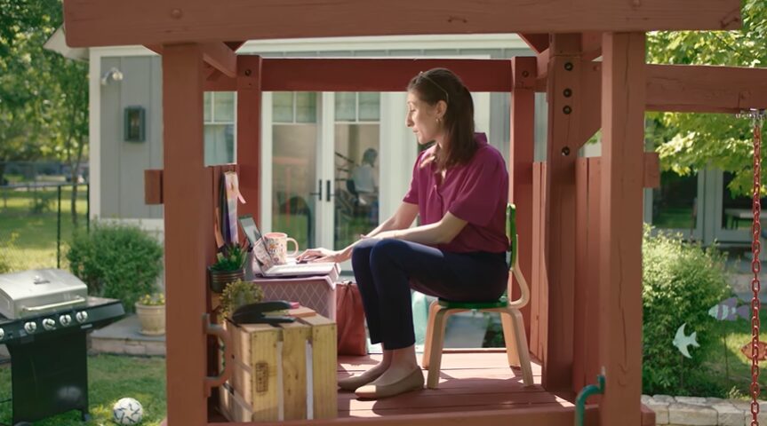 woman on a corporate call in a kids playhouse for Vonage commercial