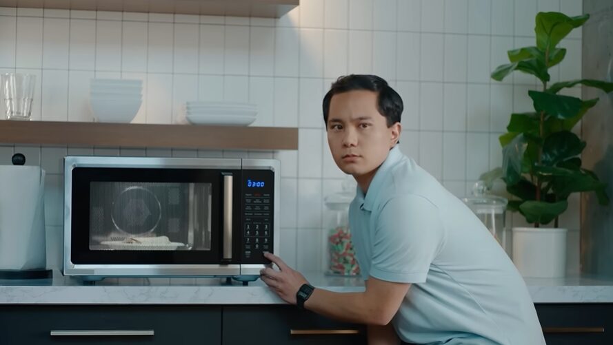 Man heating a burrito in a microwave for Vonage commercial