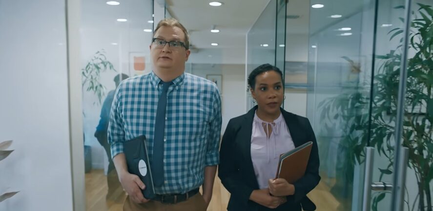 Two professionals walking down a hallway for semrush commercial