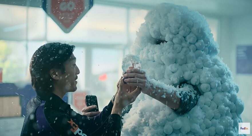 Professional helping a guy covered in foam for fedex commercial