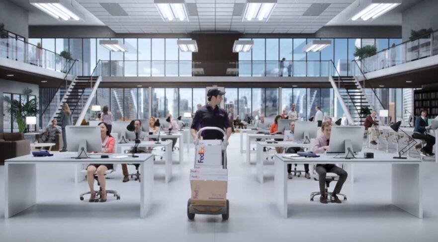 Fedex man walking through a growing business for fedex commercial