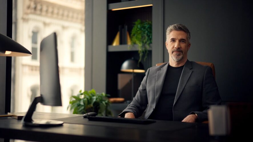 Man sitting in an office for Brex commercial