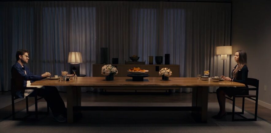 A couple sitting at a dinning table for Brex Commercial