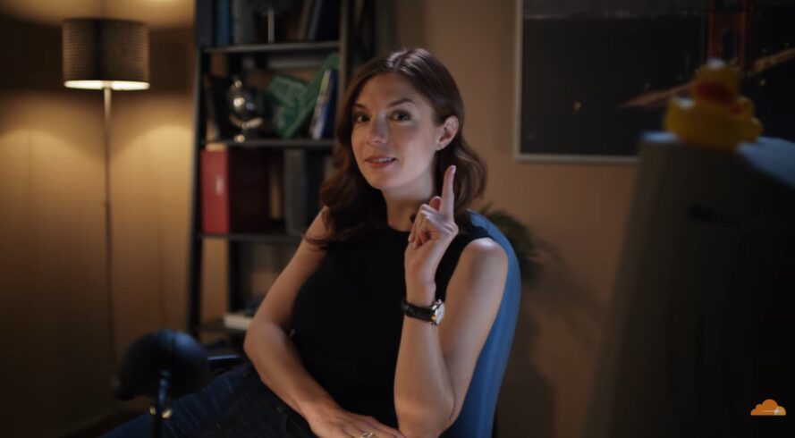 Professional sitting in a dark office for cloudfare commercial