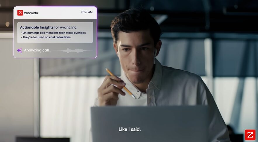 professional sitting in front of a laptop for ZoomInfo commercial