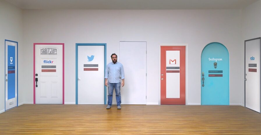 Man standing in front of animated doors for 1Password Commercial