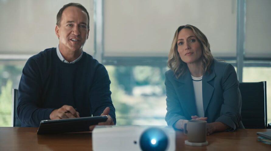 A professional in a meeting with Peyton for Nationwide commercial