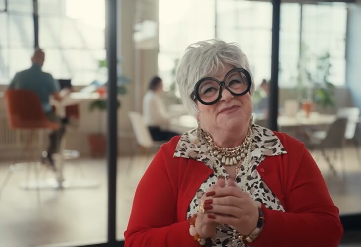 elderly woman working in an office for Zapier Commercial