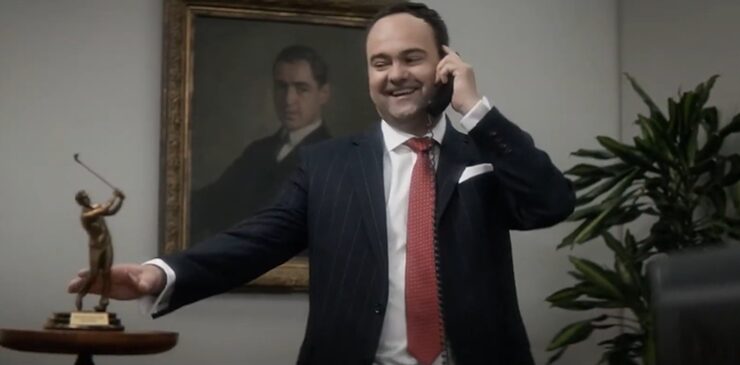 Man smiling on a phone call in an office for Workday commercial
