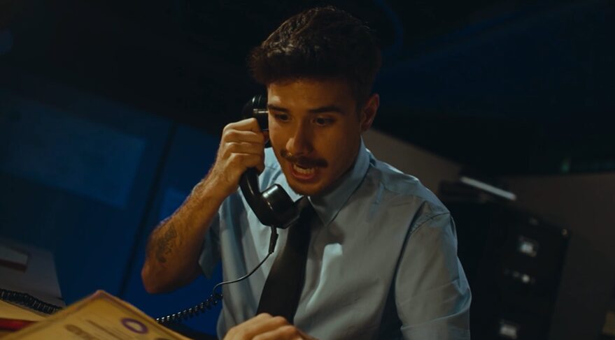 professional sitting in a dark office for Aligned commercial