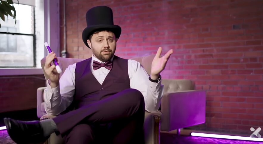 magician dressed in purple for Schoox commercial