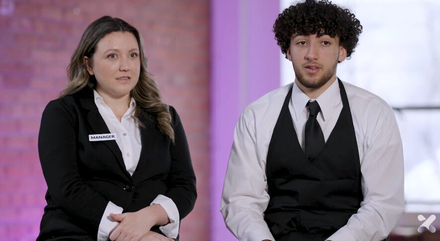 Two professionals being interviewed for Schoox commercial