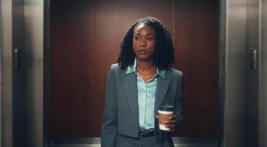 Professional walking out of an elevator for Deloitte commercial
