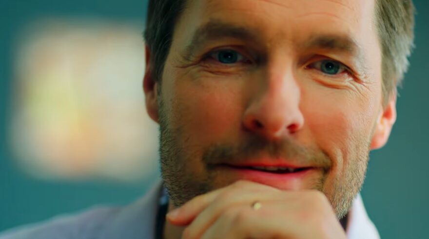 Man grinning for HubSpot commercial