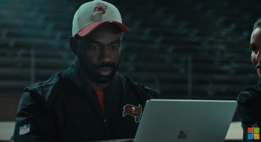 NFL Judge sitting behind a laptop for Microsoft commercial